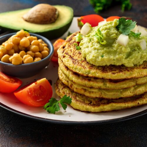 Chickpea pancakes with avocado and tomatoes